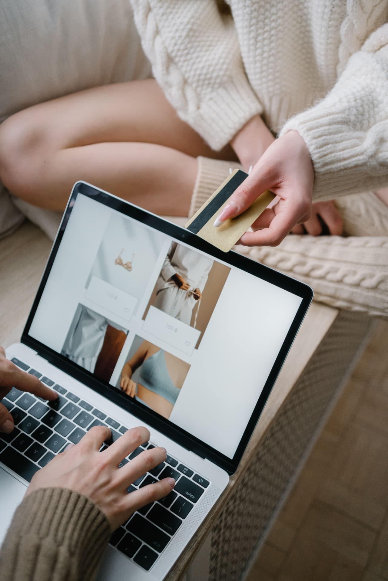 Shopper with credit card on a laptop, representing conversion-focused ecommerce optimization
