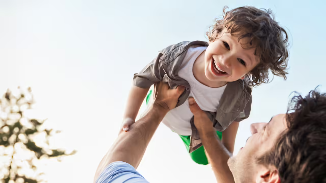 Father and child laughing, Providence patient experience